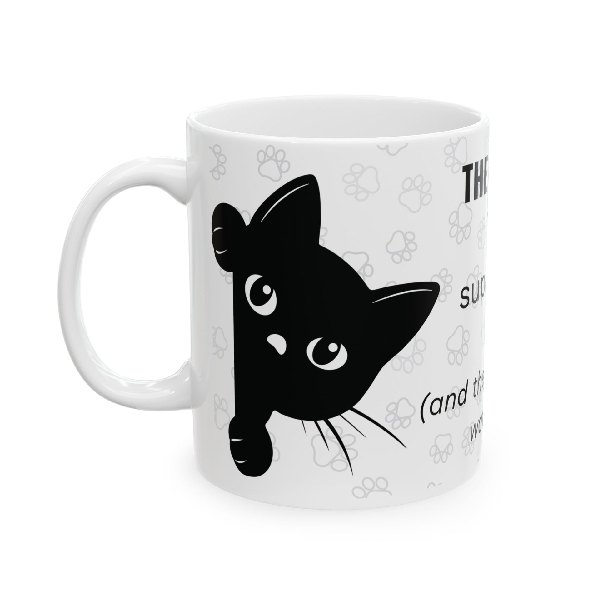 White ceramic mug featuring "The Cat Is My Supervisor" text with black cat face design and paw print pattern background. The mug shows a playful black cat silhouette with watchful eyes peeking from the side, perfect for cat-loving remote workers.